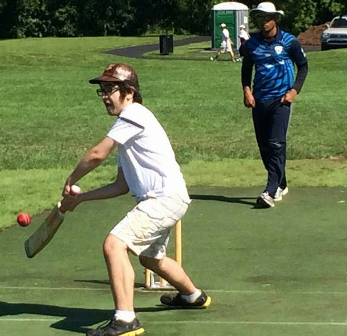 THATS SO WICKET: Rivlin tries to score by defending the wickets while playing with the Streamwood Cricket Club.