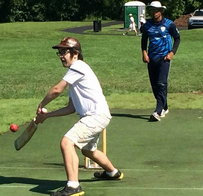 THAT'S SO WICKET: Rivlin tries to score by defending the wickets while playing with the Streamwood Cricket Club.