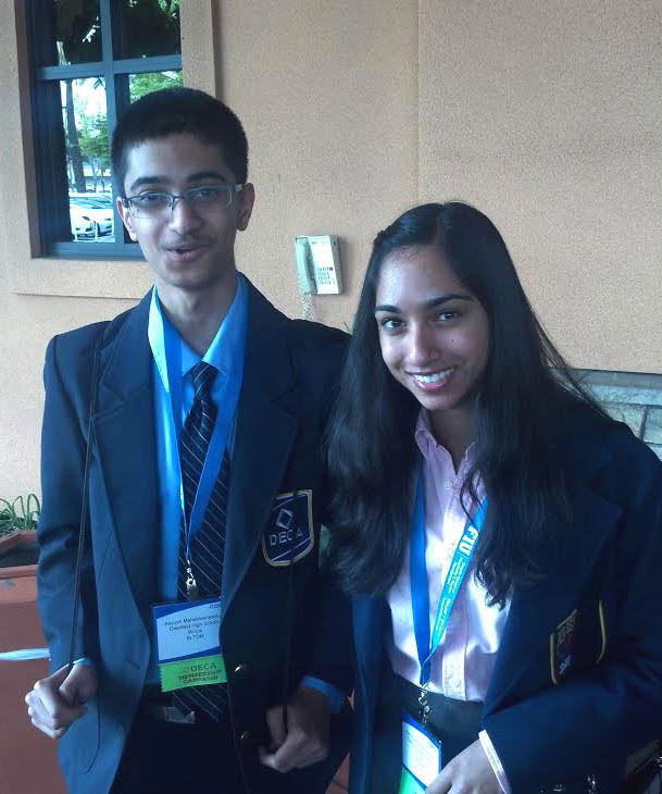 SUITED+UP%3A+Aayush+%28left%29+and+Aarohi+Mahableshwarkar+set+a+high+bar+at+DECA+competitions+by+continually+challenging+each+other.