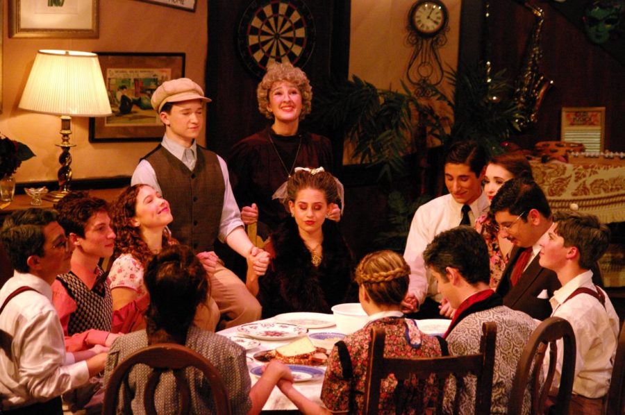 The Sycamore family in You Can’t Take it With You gathered around the dinner table. (Image courtesy of  the official DHS Friends of the Arts Facebook  page.)