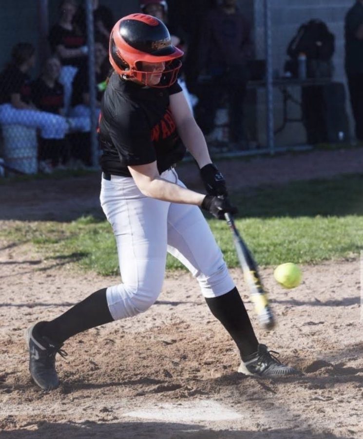 Senior Isabella Carpenter hitting a home run last season.